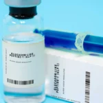 Close-up of generic GLP-1 injectable medication and syringe