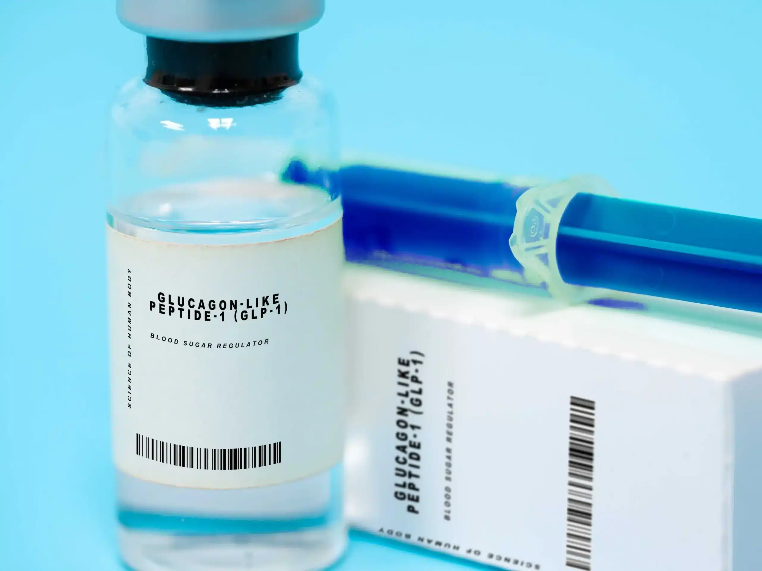 Close-up of generic GLP-1 injectable medication and syringe